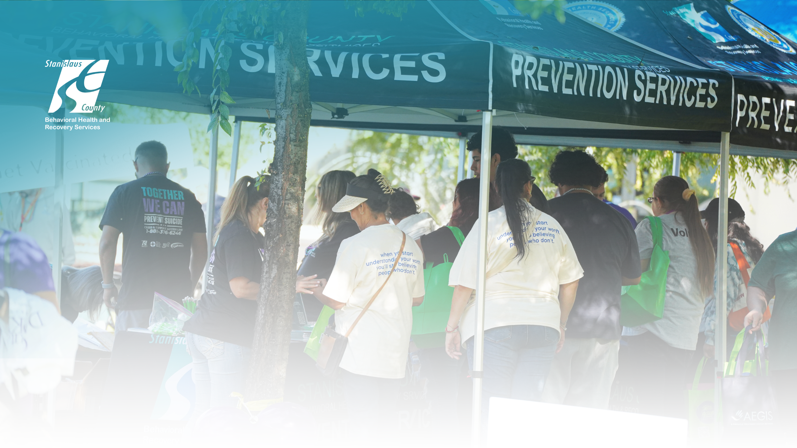 Department staff providing outreach & engagement resources at a community event.