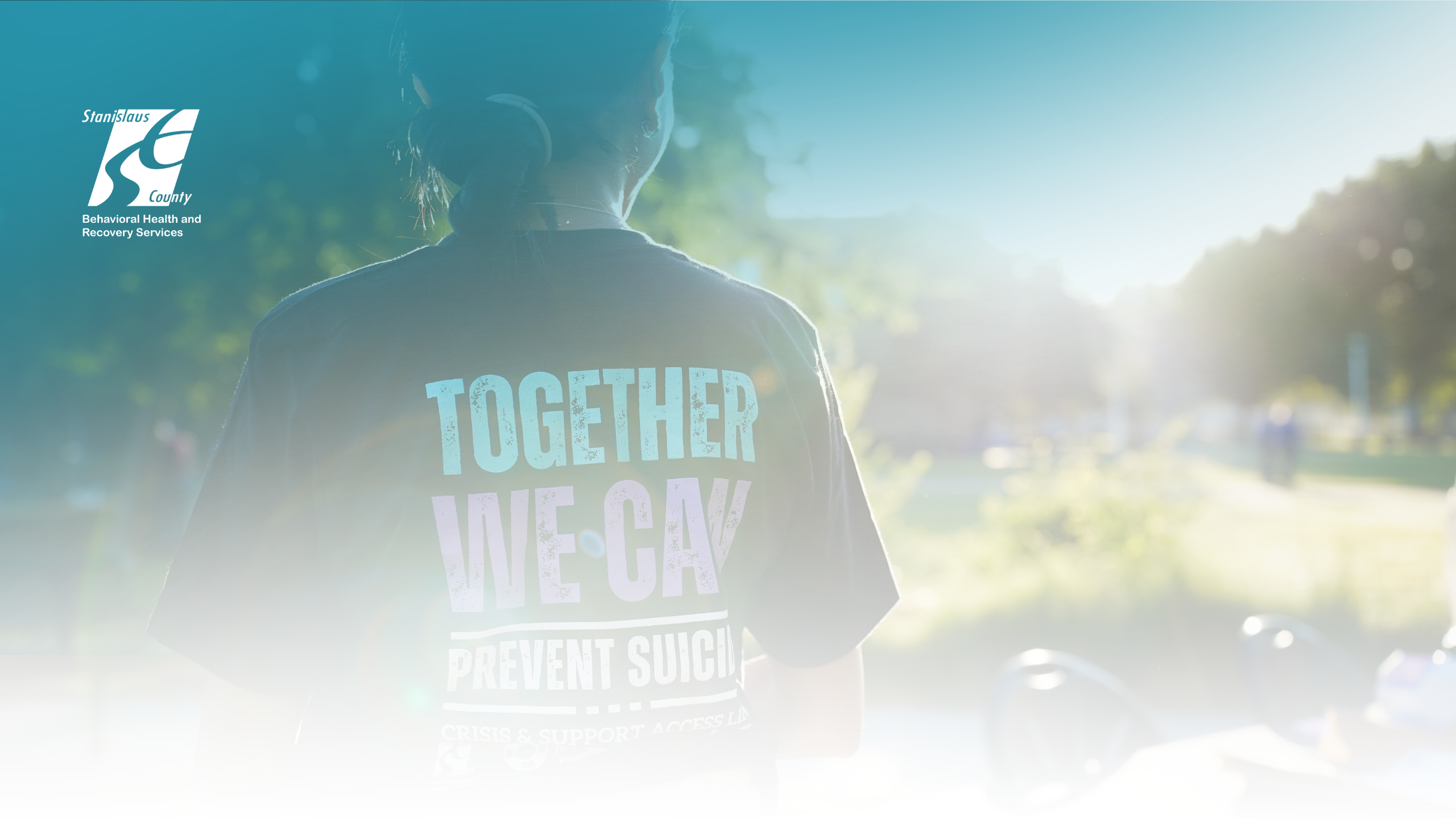 An individual's back shirt that reads “Together We Can Prevent Suicide.”