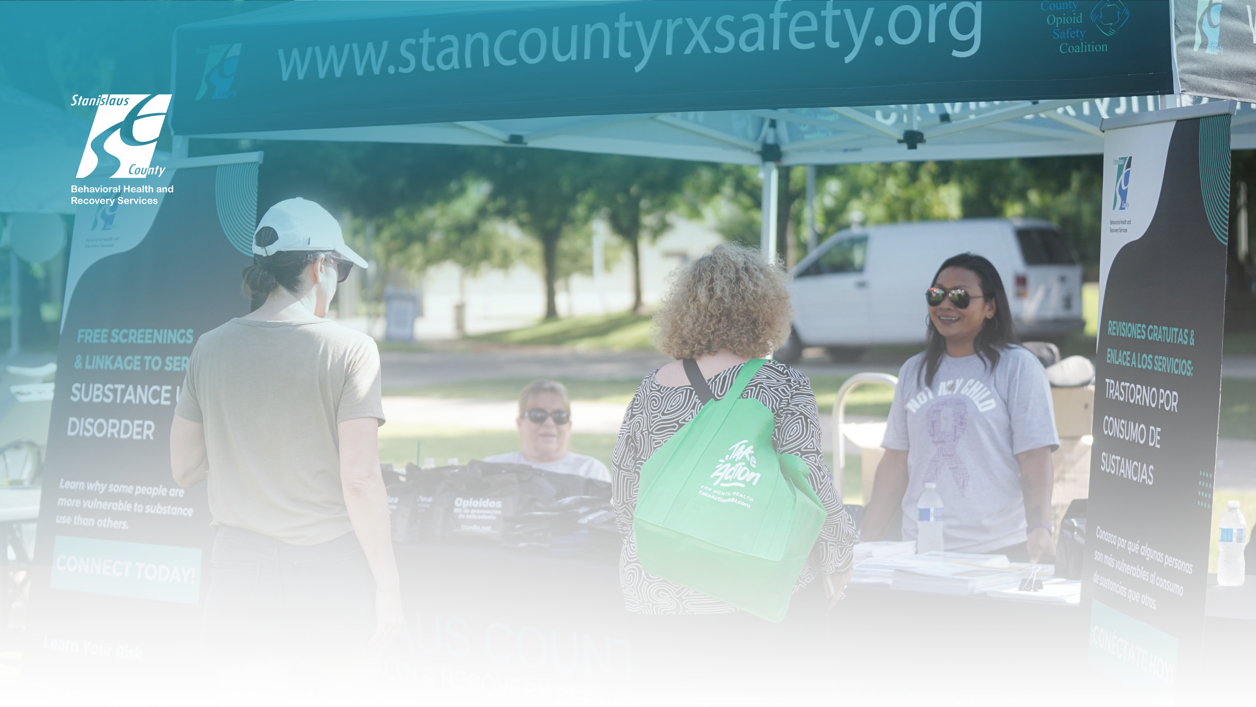 BHRS Staff providing substance use treatment screening for community members at an outreach event.