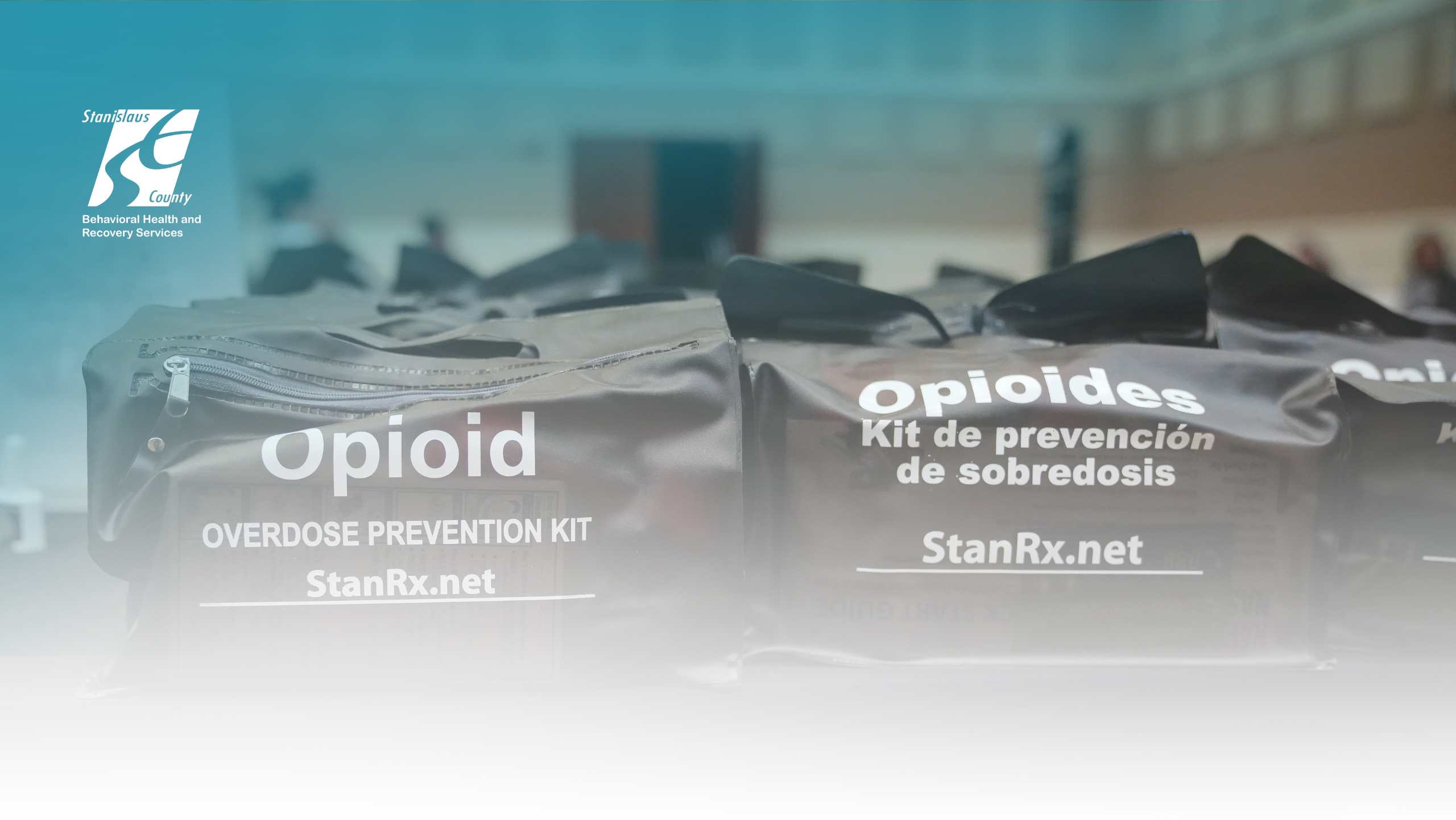 A photo of opioid Narcan kits, one bag is in English and one is in Spanish.